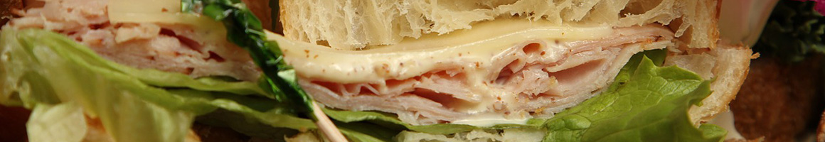 Eating Deli Sandwich at Caesar's II Delicatessen restaurant in Bakersfield, CA.